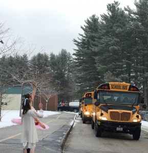 Clara and Sugar Plum wave as buses leave school